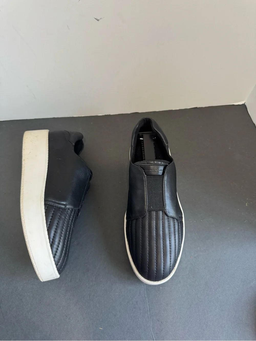 Donna Karan New York black leather slip-on sneakers. Size 6